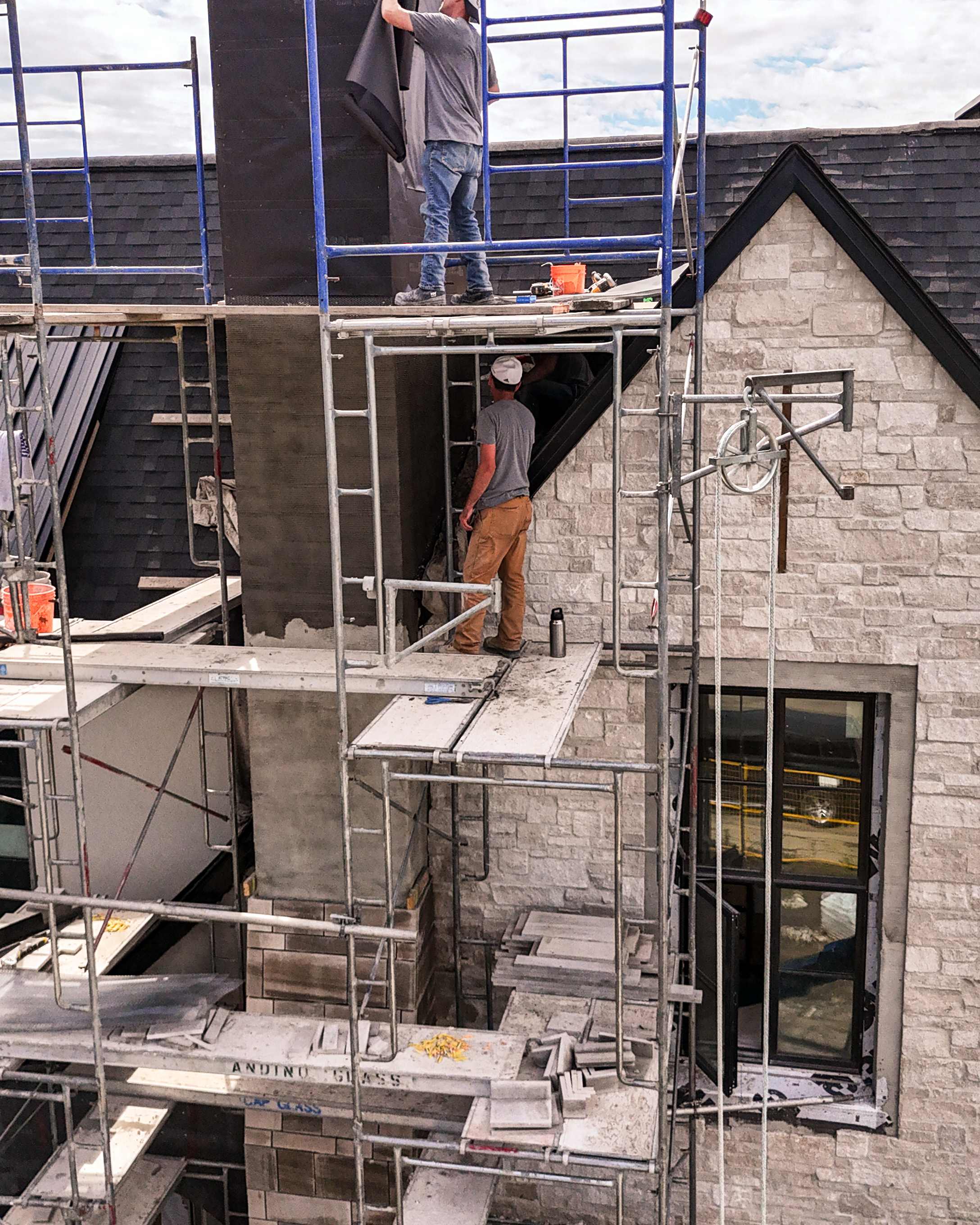 Master craftsmen working on stone masonry